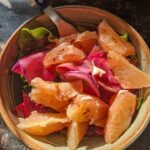 bowl of marinated raw root vegetables and fresh grapefruit