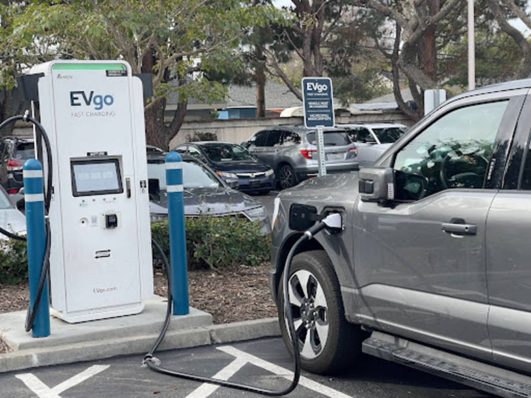An electric truck charging at an EVgo port.